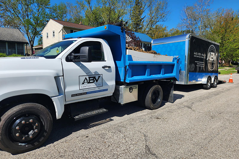 Exterior Basement Waterproofing Left Side View Truck Trailer - ABV Contractors